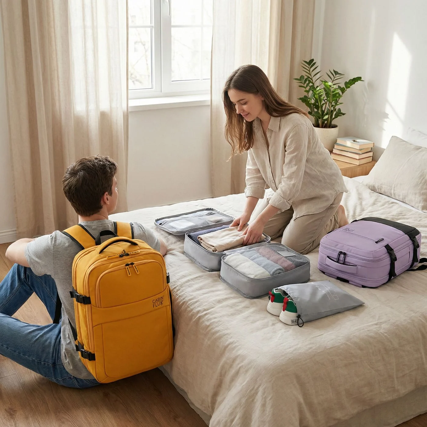 Couple packing CABIN FLUX cabin bags